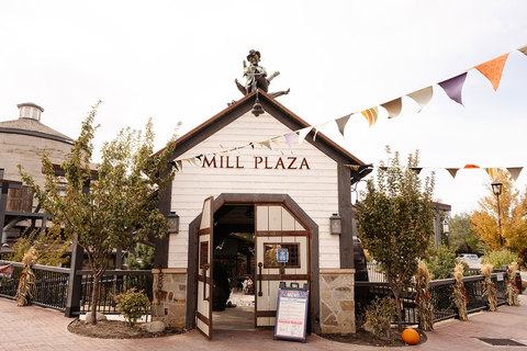 Gardner Village Witch Displays - witches on a tandem bike on mill plaza 
